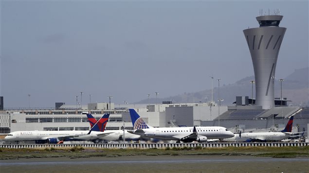 Departing and parked aircraft intersect at San Francisco International Airport, Tuesday, July 11, 2017, in San Francisco. An Air Canada Airbus A320 was cleared to land on one of the runways at the San Francisco airport just before midnight on Friday, July 7, when the pilot *inadvertently* lined up with the taxiway, which runs parallel to the runway. There were other aircraft lined up on the taxiway waiting for departure when the incident occurred.