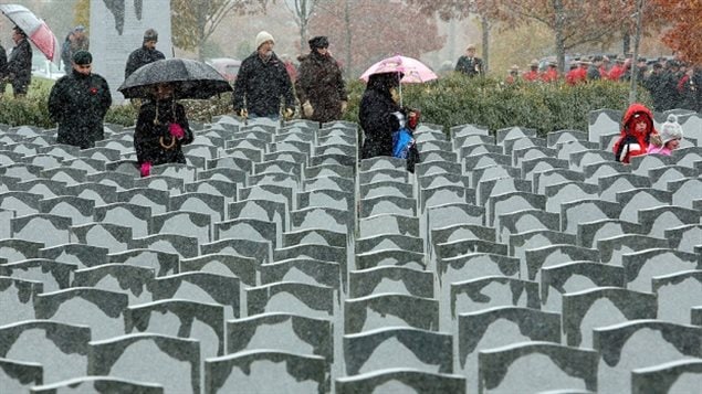 A light rain dampens the tops of grave markers at the Beechwood Military Cemetery in Ottawa. A audit of 207,000 veterans’ graves across Canada revealed that more than 45,000 require maintenance, needing some 60,000 repairs. 