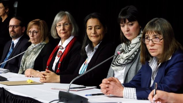 MMIWG inquiry commissioners (left-right) Brian Eyolfson, Marilyn Poitras, Marion Buller (chief commissioner), Michele Audette and Qajaq Robinson, along with lead legal counsel Susan Vella, speak with reporters in Ottawa on Feb. 7. Poitras resigned from the inquiry commission Jul 11, one of several high level resignations recently.