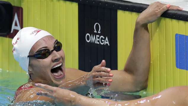 Canada’s gold medal winner Kylie Jacqueline Masse celebrates after setting a new world record in the women’s 100-meter backstroke final during the swimming competitions of the World Aquatics Championships in Budapest, Hungary, Tuesday, July 25, 2017.