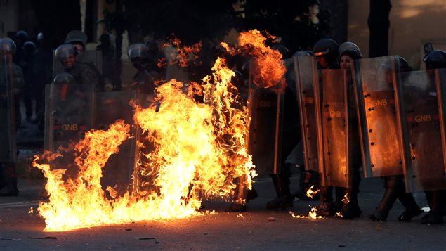 Riot security forces are set on fire at a rally during a strike called to protest against Venezuelan President Nicolas Maduro’s government in Caracas, Venezuela July 26, 2017.