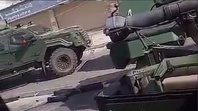A still image taken from a video posted on Twitter appears to show a Canadian-made Terradyne Gurkha APC (left) on the streets of Awamiya in the Eastern Province of Saudi Arabia. The APC is produced by Terradyne Armored Vehicles Inc. based in Newmarket, Ontario.