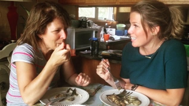 Katelynn Langer, 25, and her mother, Marjorie, 50, share dinner together. Langer moved in with her mother last year but plans to strike out on her own as soon as she’s paid off her student loans. 