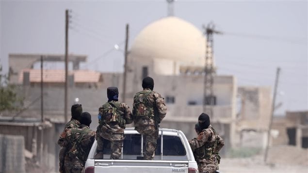 Combatientes de las Fuerzas Democráticas Sirias en Raqqa.