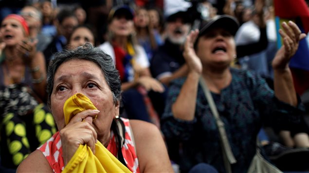A woman cries during a rally where opposition supporters pay tribute to victims of violence in protests against Venezuelan President Nicolas Maduro’s government, in Caracas, Venezuela July 31, 2017.