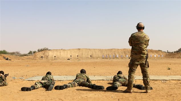 A member of Canadian Special Operations Forces Command coaches members of the Niger Armed Forces on marksmanship during Flintlock 2017 in Diffa, Niger, March. 2, 2017. Flintlock is a special operations forces exercise designed to hone the capabilities of U.S. and partner nation military units in Trans-Saharan Africa. (U.S. Army photo by Staff Sgt. Kulani Lakanaria)