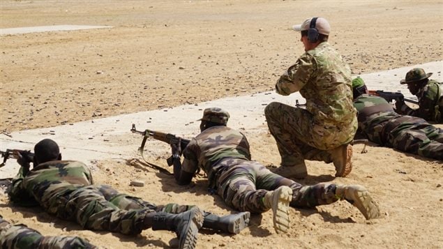 A member of Canadian Special Operations Forces Command observes members of the Niger Armed Forces during marksmanship training as part of Flintlock 2017, in Diffa, Niger, March 1, 2017. Flintlock is a special operations forces exercise designed to hone the capabilities of U.S. and partner nation military units in Trans-Saharan Africa. (U.S. Army photo by Spc. Zayid Ballesteros)