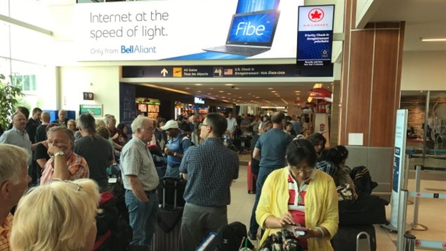 Many flights were delayed in eastern Canada and people had to wait to be checked in manually.