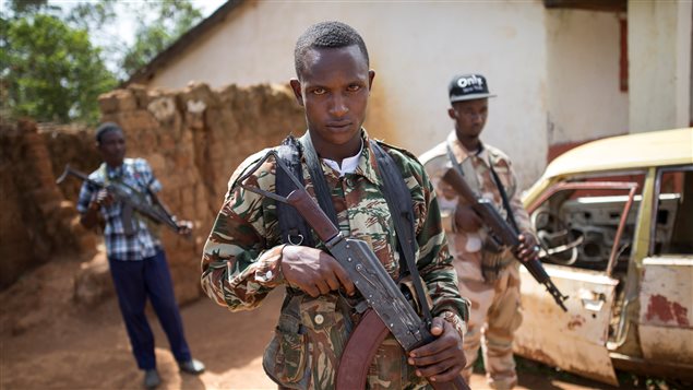 Armed fighters belonging to the 3R armed militia stands guard while their leader General Sadiki is talking to the media in the town of Koui, Central African Republic, April 27, 2017.