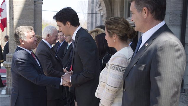 Jordan’s King Abdullah II speaks with then Liberal Leader Justin Trudeau as his wife Sophie Gregoire and Canada’s Ambassador to Jordan Bruno Saccomani look on during an official weleome to Rideau Hall Wednesday April 29, 2015 in Ottawa.