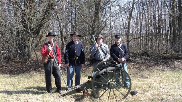 Members of the Grays and Blues of Montreal with replica short-barrel mountain howitzer during an event in Ontario in 2013