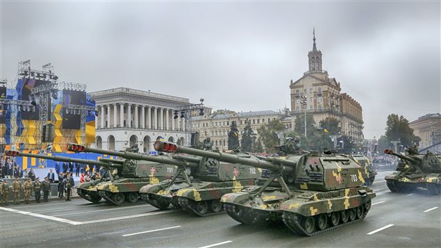 Self-propelled howitzers ride along Khreshchatyk Street during a military parade to mark the 25th anniversary of Ukraine’s Independence, in the capital Kiev, Ukraine, Wednesday, Aug. 24, 2016. 