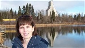 Janice Martell shown in front of the old McIntyre Mine headframe in Schumacher, northern Ontario. She’s been leading the campaign to document connection fo McIntyre powder to high incidence of miner brain damage