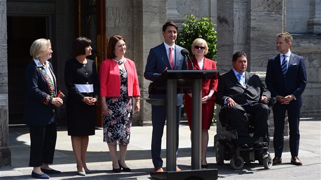 Prime Minister Justin Trudeau presents members of his newly-shuffled cabinet at a news conference.