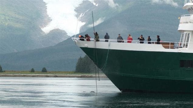 NOAA-trained marine mammal responders collect a sample from the exhalation of an entangled a humpback whale on Sunday, August 27, near the mouth of Tracy Arm, Alaska.