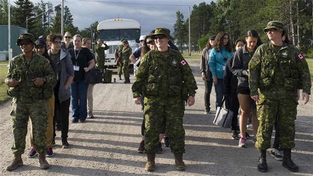 These women arrive at the Canadian Forces Base and line up by Military personnel for their 10-day experience as *soldiers*. Theywere curious about careers in the Canadian Forces and felt this would give them a sense of that life before committing to join.