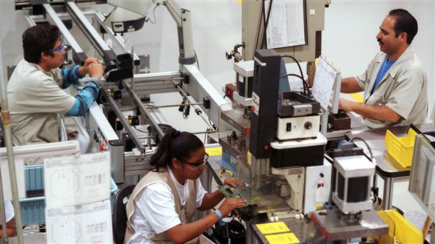 Trabajadores en une fábrica maquiladora en Ciudad Juarez, México