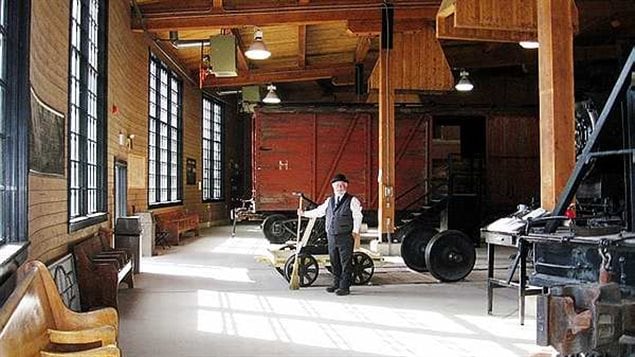 Interior photo of Calgary’s Heritage Park roundhouse where several heritage engines, rolling stock and railway artefacts are housed.