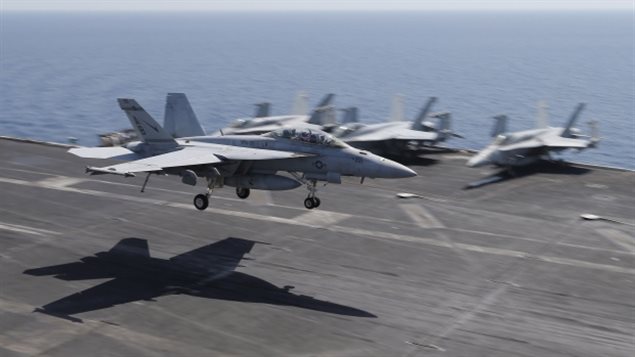 Super Hornet fighter jets are shown landing on the flight deck of the USS Theodore Roosevelt aircraft carrier. Canada says it is rethinking the 6.3 billion dollar purchase of 18 of the Boeing fighters in light of Boeing’s trade complaint against Bombardier