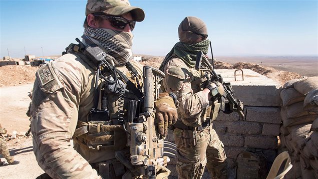 Canadian special forces look over a Peshmerga observation post, Monday, February 20, 2017 in northern Iraq.