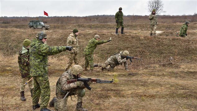 Canadian instructors of Joint Task Force - Ukraine provide guidance and safety support to Ukrainian soldiers during section attack practice as part of small team training, at the International Peacekeeping and Security Centre in Starychi, Ukraine, on March 3, 2017.