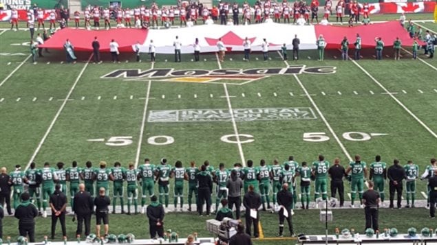 Anti-Trump protests by NFL players in the U.S, has spread to Canada with Saskatchewan Roughriders linking arms this weekend during the Canadian anthem in solidarity with NFL protesters south of the border.