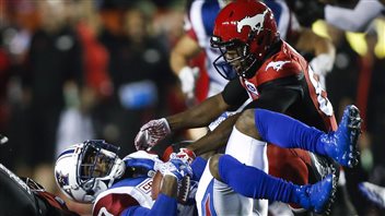 Bigger and faster players and state-of-the-art protection equipment is resulting in more and more injuries to football players. Here, Montreal Alouettes running back Stefan Logan (0) is tackled by a Calgary Stampeder in a game last weekend. 