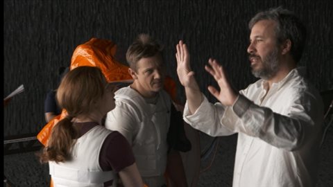 Hollywood's hottest director, Denis Villeneuve, right, gives guidance to Amy Adams and Jeremy Renner on the Montreal set of 