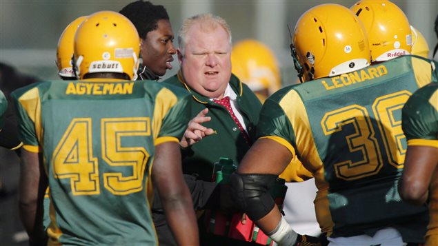 Toronto Mayor Rob Ford speaks to his Don Bosco Eagles team during the Metro Bowl quarter-final at Birchmount Park in Toronto in 2012. Ford, who loved football, spent many years coaching amateur football. On Wednesday, Toronto's city council rejected naming a stadium for him.