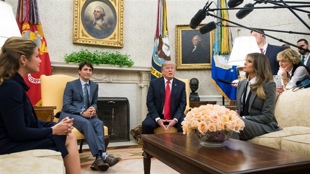 U.S. President Donald Trump (2nd-R) and first lady Melania Trump (R) meet with Canadian Prime Minister Justin Trudeau (2nd-L) and his wife Gregoire Trudeau in the Oval Office at the White House on October 11, 2017 in Washington, DC.