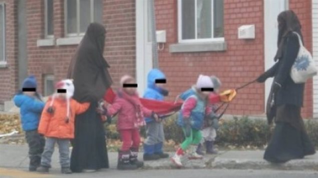 A photo posted online in November 2013 of two daycare workers in Quebec sparked a heated debate in the province