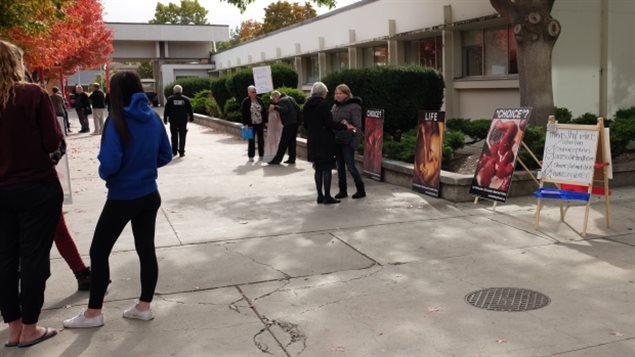 Demonstrators gathered outside the Okanagan College Kelowna campus with large, graphic photos of aborted fetuses.  Ontario will ban such activities within 50 metres of abortion clinics