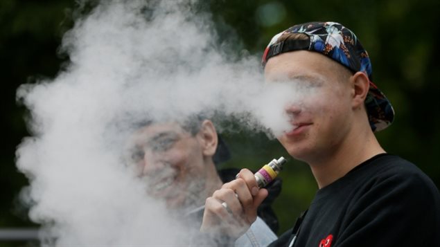 A man exhales e-cigarette vapour. A study of more than 44,000 Grade 9 to 12 students in Ontario and Alberta shows a linkage between so-called vaping and subsequent tobacco use. 