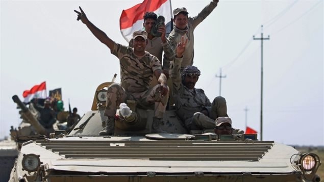 Iraqi forces drive towards Kurdish Peshmerga positions on October 15, 2017, on the southern outskirts of Kirkuk.which the Kurds occupied after chasing out Daesh. A temporary halt to Canadian military assistance will remain in effect until it’s clear the fighting between pro-independence Kurds and the central government in Baghdad is over. 