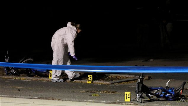 Police investigate crushed bicycles on a bicycle lane the day after a pickup truck attack on the West Side Highway in Manhattan, New York, U.S., November 1, 2017.