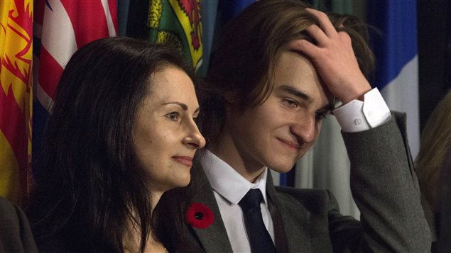 Sergei Magnitsky’s son, Nikita Magnitsky, and his mother, Natalia, are seen during a news conference on Parliament Hill in Ottawa, Wednesday November 1, 2017.