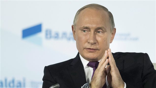 Russian President Vladimir Putin gestures while speaking at the plenary session of the an annual meeting of the Valdai International Discussion Club in the Black Sea resort of Sochi, Russia on October 19, 2017. Russian President Vladimir Putin is accusing Canada of playing *unconstructive political games* by passing its own Magnitsky law earlier this month. 