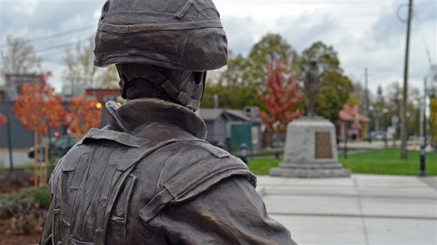 The sculpture is positioned so that the soldier is looking at the WWI monument and cenotaph, site of Remembrance ceremonies in St Thomas, Ont.