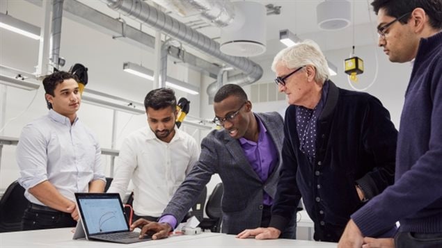 The sKan team members, left to right, Prateek Mathur, Shivad Bhavsa, Rotimi Fadiya, and, far right, Michael Takla meet with inventor James Dyson, who is second from right, after winning this year’s James Dyson Award.