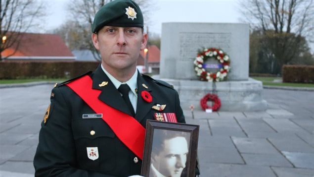 Warrant Officer Matt Russell, taking part in Passchendaele commemorations, shows a picture of his great grandfather who fought here. His memory ”makes me feel really proud,” Russell said. “It is a little emotional because it’s hard to imagine what they went through.* 