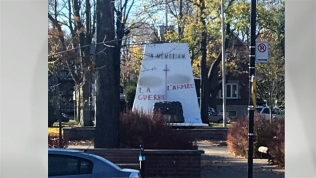 Berj Merdjani was entering his photography studio Saturday morning when he saw the war memorial across the street in Montreal was vandalized . CBC News has blurred out offensive language in the photo.