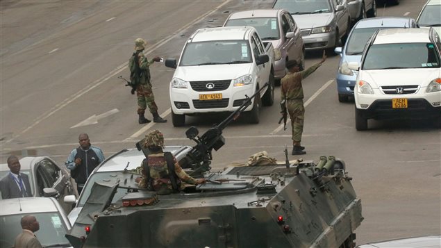 Military vehicles and soldiers patrol the streets in Harare on Nov. 15, 2017.