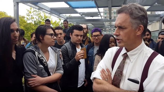 2016: Award winning University of Toronto psychology professor Jordan Peterson attempts to explain his position to a crowd oustide the university before being disrupted by an unruly group of protesters.