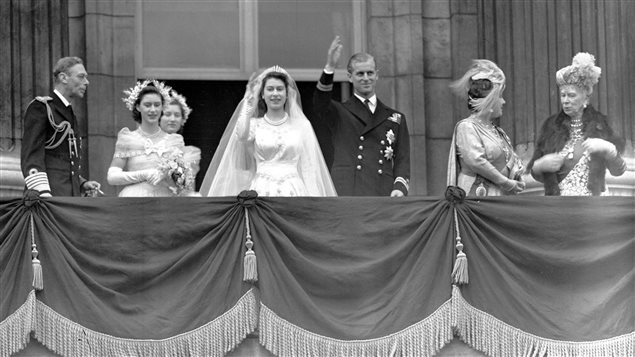 Britain’s Queen Elizabeth II, then Princess Elizabeth, and her husband Prince Philip, the Duke of Edinburgh, wave to the crowd from the balcony of Buckingham Palace, London, in this Nov. 20, 1947 file photo, after their wedding. From left to right, King George VI, Princess Margaret, Lady Mary Cambridge, the bride and bridegroom, Queen Elizabeth and Queen Mary. 
