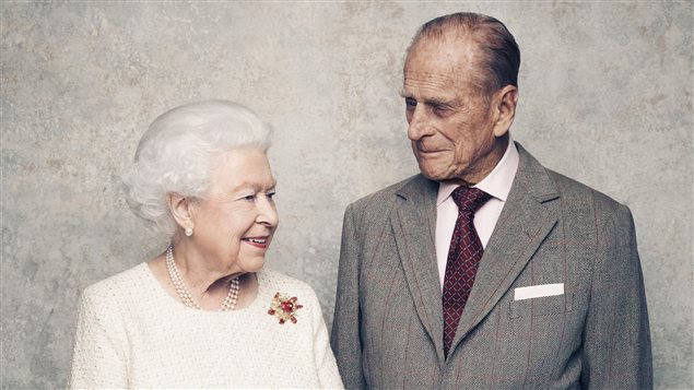 In this handout photo issued by Camera Press and taken in Nov. 2017, Britain’s Queen Elizabeth and Prince Philip pose for a photograph in the White Drawing Room pictured against a platinum-textured backdrop at Windsor Castle, England. 