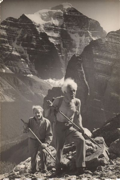Lawren Harris (ftont) and Ira Dilworth hiking near Mt Temple, Canadian Rockies circa 1930