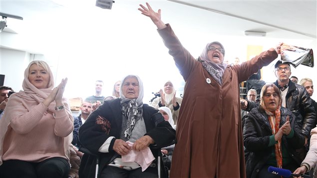 A woman reacts as she watches a television broadcast of the court proceedings of former Bosnian Serb general Ratko Mladic in the Memorial centre Potocari near Srebrenica, Bosnia and Herzegovina, November 22, 2017.