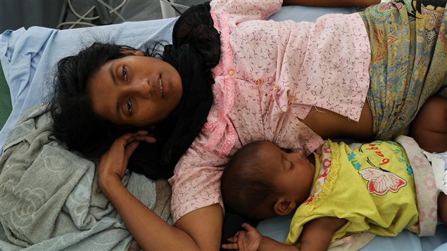 Rohingya refugee Ufaira Begom, 25, who suffers from vomits and dehydration, lies on a hospital bed with her 6-month-old baby Shehena at the Norwegian-Finnish Red Cross field hospital at Kutupalong refugee camp near Cox’s Bazar, Bangladesh, November 22, 2017.