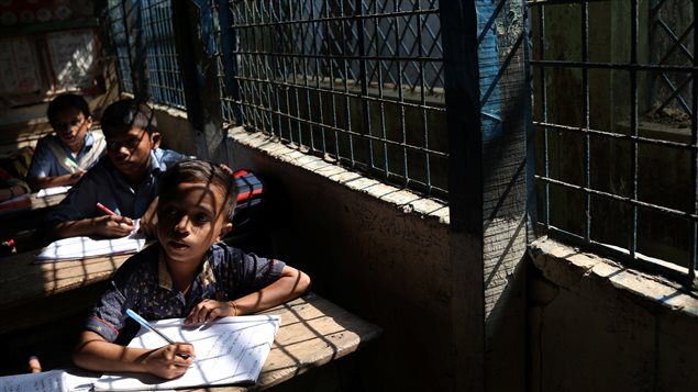 Rohingya refugee children attend class in Long Beach Primary School at Kutupalong refugee camp near Cox’s Bazar, Bangladesh, November 22, 2017. 