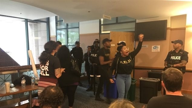 Protests delayed a meeting of the Toronto Police Services Board where members were considering whether to suspend a program that puts uniformed officers in some Toronto schools